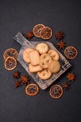 Delicious fresh sweet crispy butter cookies on a dark background
