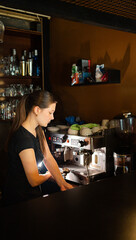 Process of coffee making using coffee machine. Barista is preparing fresh espresso for customers