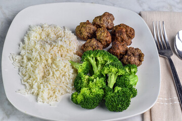 rice  with meatballs and  broccoli