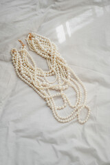 Pearl necklace. Shiny background of jewelry. Royal luxury pearl beads