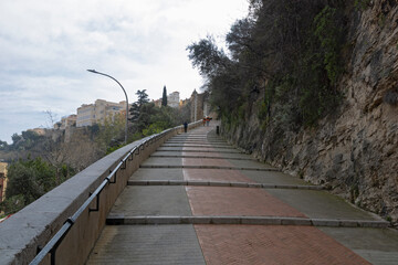 Tourists going up the ramp to The Prince Palace of Monaco in Monaco-Ville.