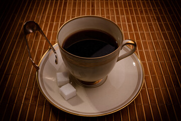 Snapshot of a coffee cup with coffee spoon and shugar