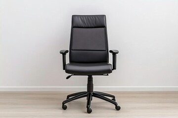 Fototapeta premium A sleek black office chair with ergonomic design on a smooth wooden floor, perfect for modern workspace aesthetics.