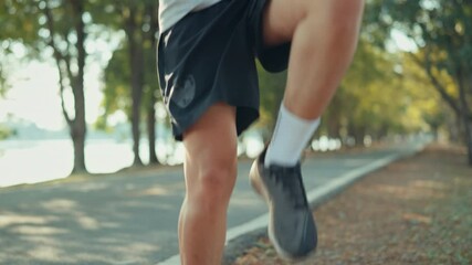 Close up - Asian sport man runner for running warm up, Preparing for running in public park in the fresh air outdoor, Wellness, healthy active lifestyle.
