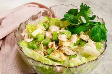 Waldorf salad, celery salad with apple, in a glass salad bowl, natural light, homemade, no people,