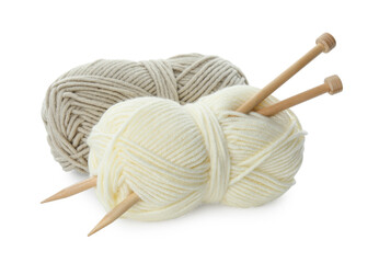 Skeins of soft yarn and knitting needles isolated on white