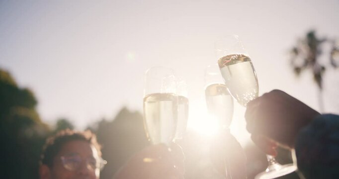 Celebration, friends and hands toast with champagne, having fun and bonding at sunset. Bellow, group and people cheers with wine glass, alcohol and drink for party relax on holiday or summer vacation