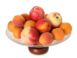 Glass vase with different fresh fruits isolated on white