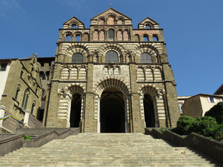 Obraz premium Cathedral of Puy-en-Velay. 12 century. France. View of the main facade decorated with colorful volcanic stones.