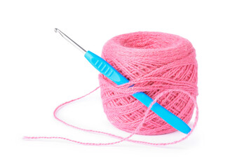 Thread of pink yarn and crochet hook isolated on white