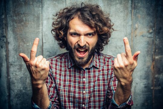 A humorous defiant gesture of a person displaying their middle fingers, conveying a lighthearted and playful attitude