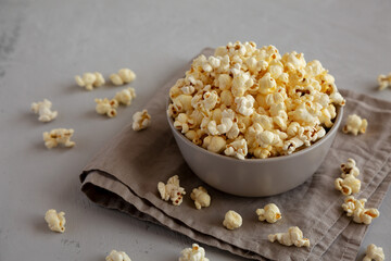 Homemade Salty Popcorn in a Bowl, side view.