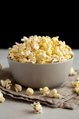 Homemade Salty Popcorn in a Bowl, side view.