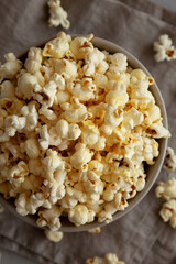 Homemade Salty Popcorn in a Bowl, top view.