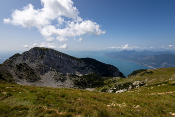 Fototapeta premium hike on the Monte Baldo massif with Lake Garda in the background on the border between the Veneto region and Trentino Alto Adige, Italy