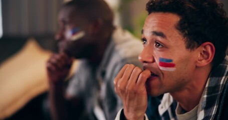 Nervous, game and man watching tv for sports competition, biting nails or match results in home. Football fan, fear and scared male person on sofa for television and streaming for soccer tournament