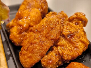 Korean fried chicken. Soy garlic chicken wings tossed in savory, sweet and spicy sauce. Fast food. Korean cuisine
