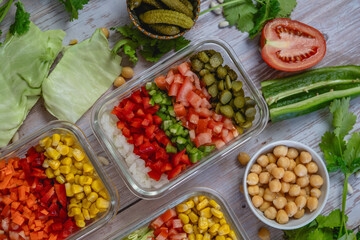 different vegetables cut in a bowl. Colorful shades. cabbage, peppers, onion, corn, tomato, pickle.