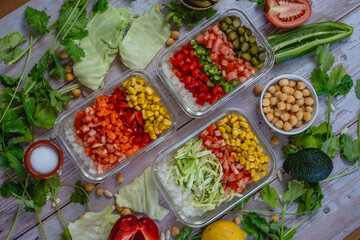 different vegetables cut in a bowl. Colorful shades. cabbage, peppers, onion, corn, tomato, pickle.