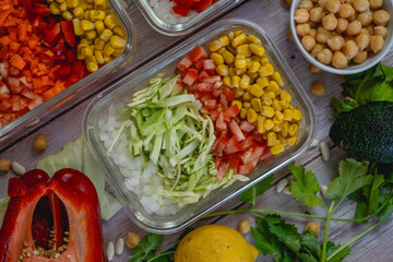different vegetables cut in a bowl. Colorful shades. cabbage, peppers, onion, corn, tomato, pickle.