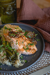 salmon with sauce, sesame and pakchoi