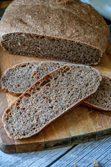 slice of rustic bread on a dark background and breakfast set. 