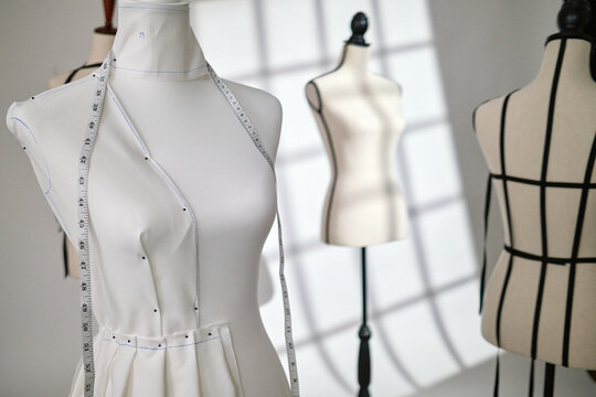 Dress Forms Media Mannequins with seamstress tailor tailoring in warehouse loft Atelier studio with window lighting