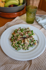 Pea Dish on a Cozy Home Table. A delicious plate of peas served on a homestyle table, creating a warm and inviting atmosphere. The simple presentation reflects wholesome, homemade cooking
