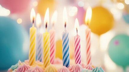 Colorful birthday cake with candles lit, celebrating a joyful occasion indoors surrounded by festive decorations