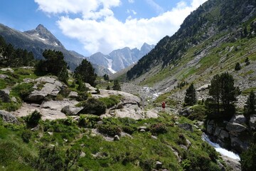 Beautiful scenery of Pyrenees National Park. Tourist trail to Refuge des Oulettes de Gaube around mountain massif with glacier Oulettes and Vignemale - the highest peak of French Pyrenees.