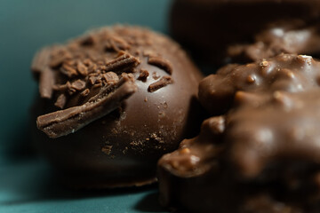 Close-up of some chocolate truffles covered with nuts