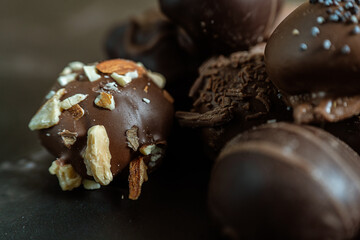 Close-up of some chocolate truffles covered with nuts