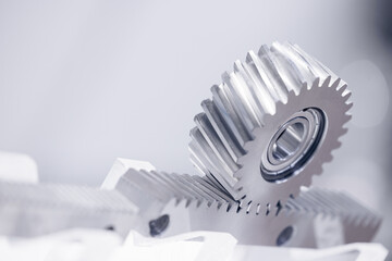 Closeup metal engine gear wheels, industrial background blue color, concept car service