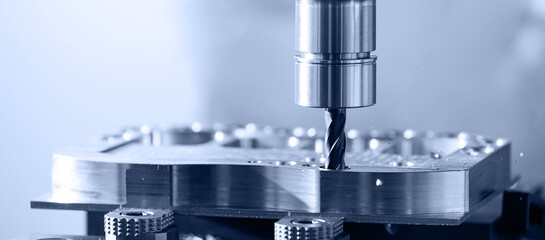 Modern CNC milling machine during operation. Produced cutting metal parts, industry heavy factory