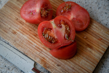 Vivipary seeds germinating inside overripe tomato on the cutting desk