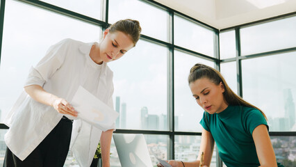 Smart businesswoman present start up project while executive manager listen carefully. Professional business team working together, sharing, discussing, thinking about business idea. Tracery