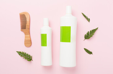 Professional herbal hair care products on color background, top view