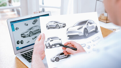 Car design engineer analyze car prototype for automobile business at home office. Automotive engineering designer carefully analyze, finding flaws and improvement for car design with laptop Synchronos