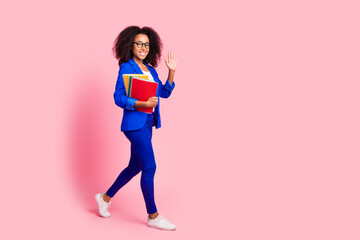Photo of lovely pretty charming girl wear stylish blue clothes hold books isolated on pink color background