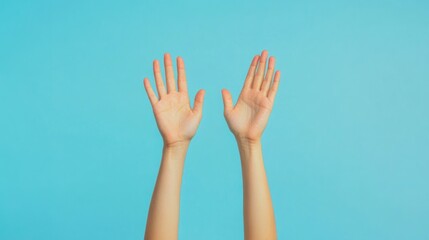 Obraz premium Raised Hands on Blue Background