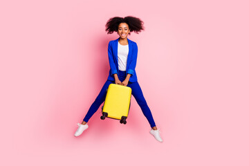 Photo of funny cheerful lovely girl wear trendy blue clothes hold valise isolated on pink color background