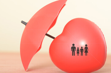 The image of a family symbol protected by an umbrella represents the importance of family life...