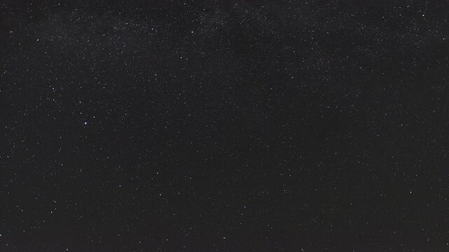 Time-lapse of the Milky Way moving across the night sky. Captures the mesmerizing motion of stars and cosmic detail in a clear, dark sky.