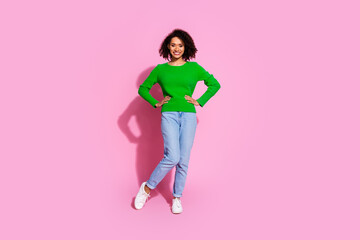 Full length photo of lovely young lady posing model dressed stylish green garment isolated on pink color background