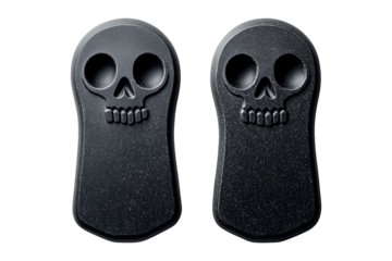 Decorative tombstone sculptures featuring skull designs isolated on a white transparent background. Concept of Halloween decor and spooky themes