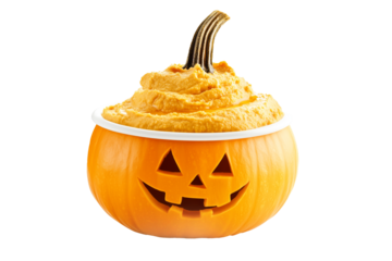 Jack-o'-lantern pumpkin filled with pumpkin puree or hummus, isolated on white background. Concept of Halloween and festive food decor