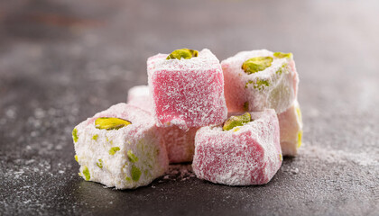 Turkish delight, soft chewy cubes of sugar-dusted confection flavored with rosewater or pistachio