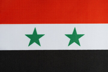 National flag country Syria closeup fabric background.