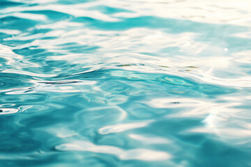 Clear water ripples on a calm surface, reflecting soft sunlight. The ripples are gentle, creating delicate wave patterns in shades of blue and turquoise. The overall mood is serene and peaceful, ideal