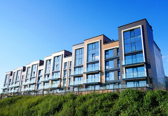 Facade of Modern complex of Apartment residential condo building. New Residential condominium building. Residential architecture exterior. Modern home, facade building. Condo Housing structure.